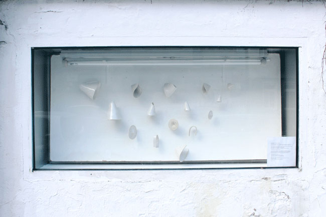 A showcase window facing the street outside the GlogauAIR art residency in Berlin with ceramic installation by the resident artist Roxanne Nesbitt in February 2017