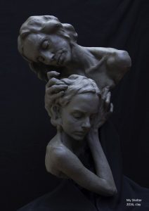 Photograph of a clay sculpture of a mother and daughter embracing, by artist Alexandra Slava, resident at GlogauAIR 2019