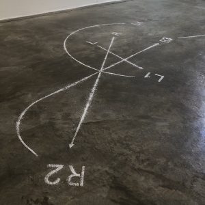 Photograph of work by artist Nesto Garcia showing markings made on a concrete floor