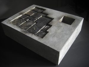 Photograph of concrete block with cut out section showing brickwork. By artist Marcos Kaiser, resident at GlogauAIR January 2020