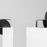 Photograph of black sculpture with white pedestals and background by artist Alejandro Urrutia, resident artist at GlogauAIR 2019