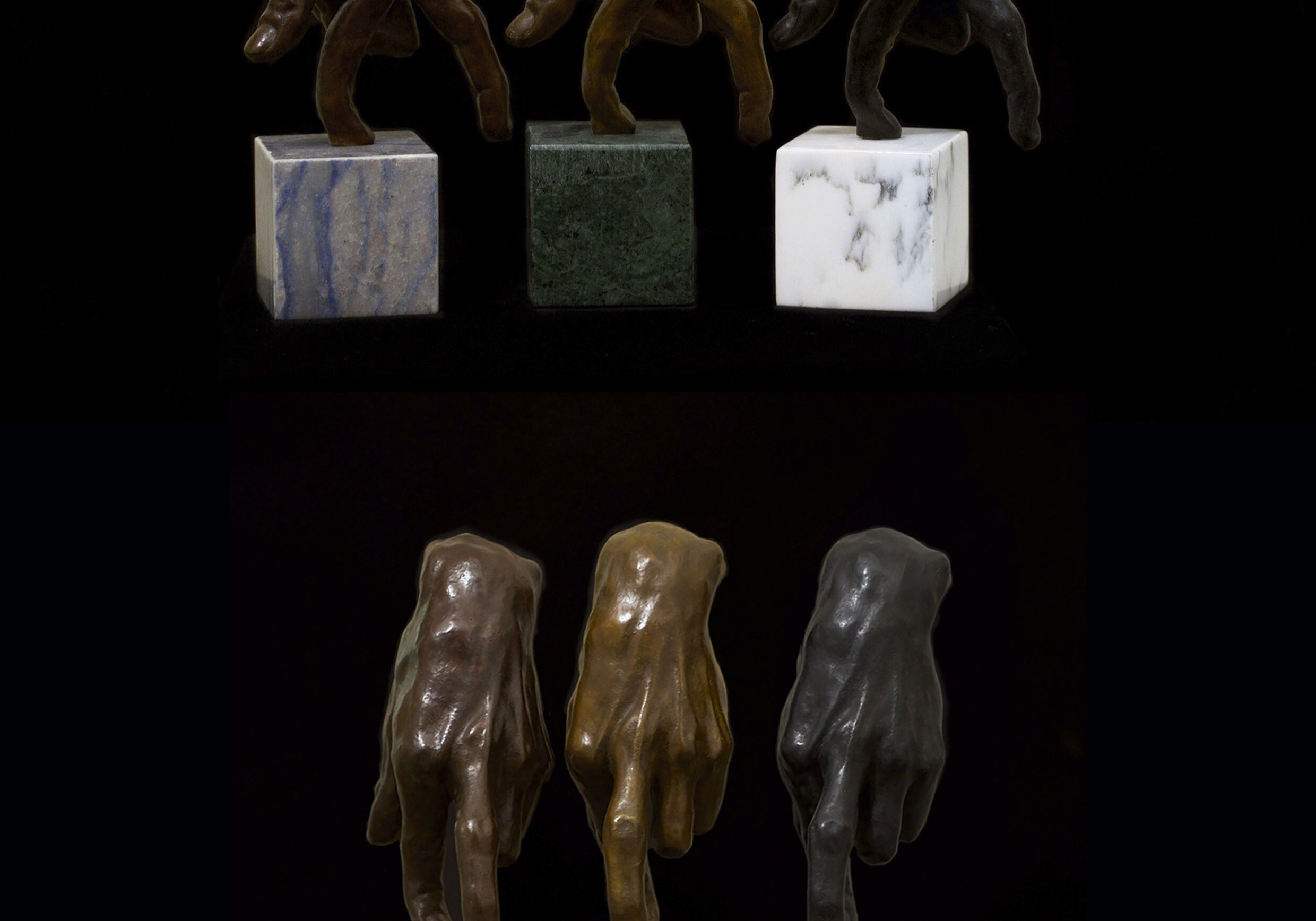 Photograph of multiple hands touching small marble blocks in different colours, by artist Alexandra Slava, resident at GlogauAIR 2019